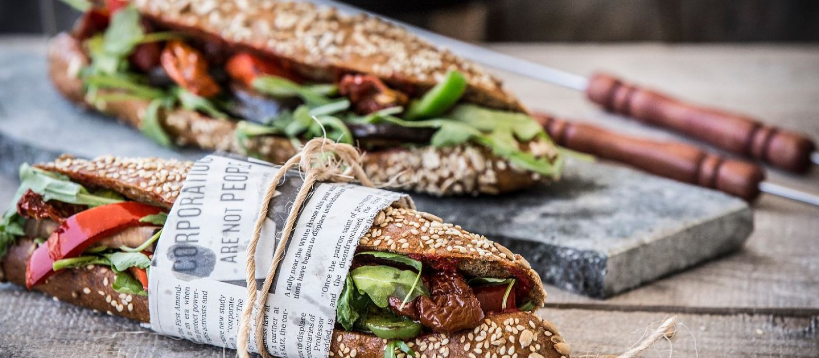 <span>Multi-grain Sub Sandwich with Roasted Vegetables, Arugula & Sun-Dried Tomato</span>
